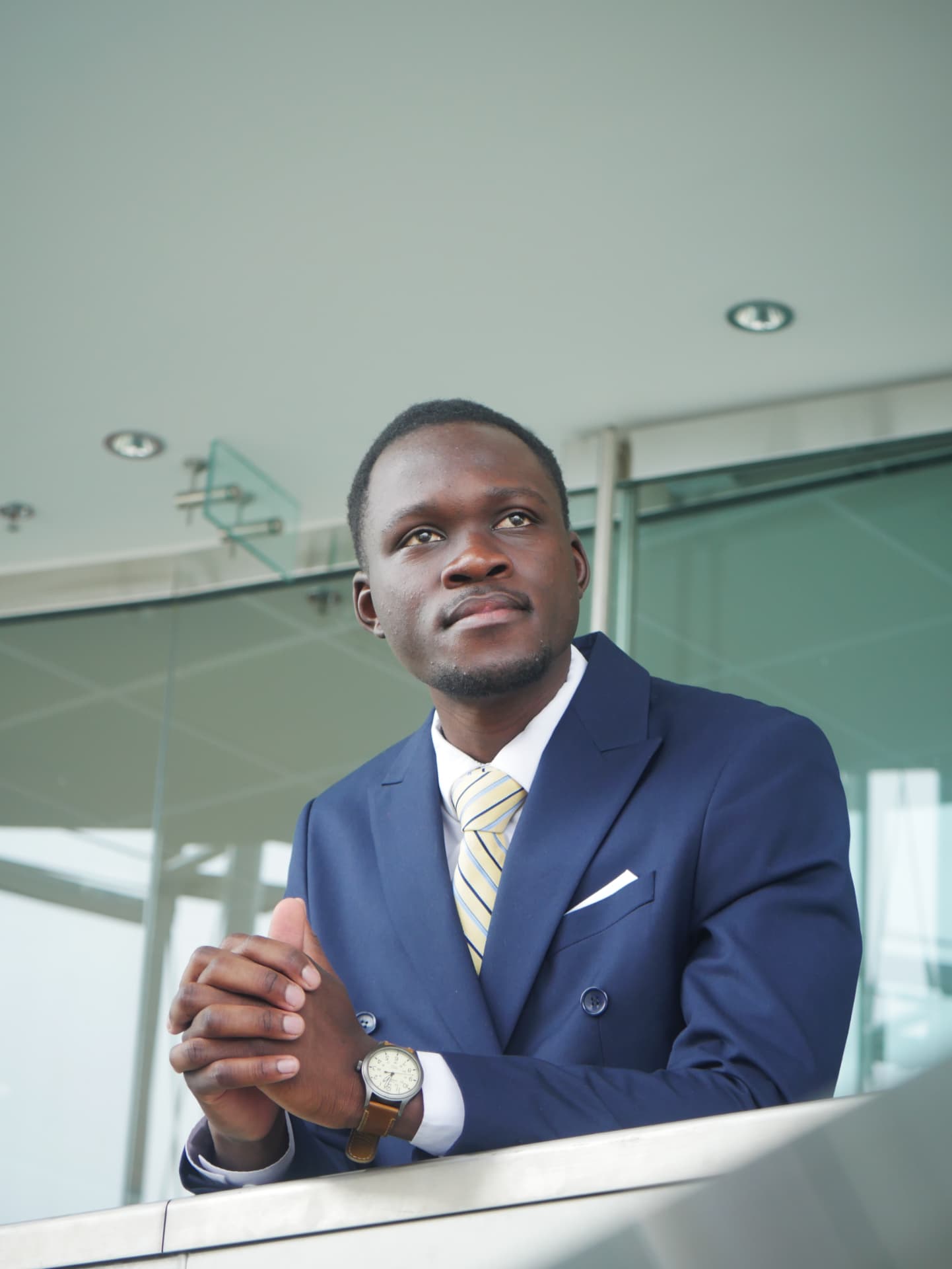 Portrait of Olemo Gordon Brian in a navy suit